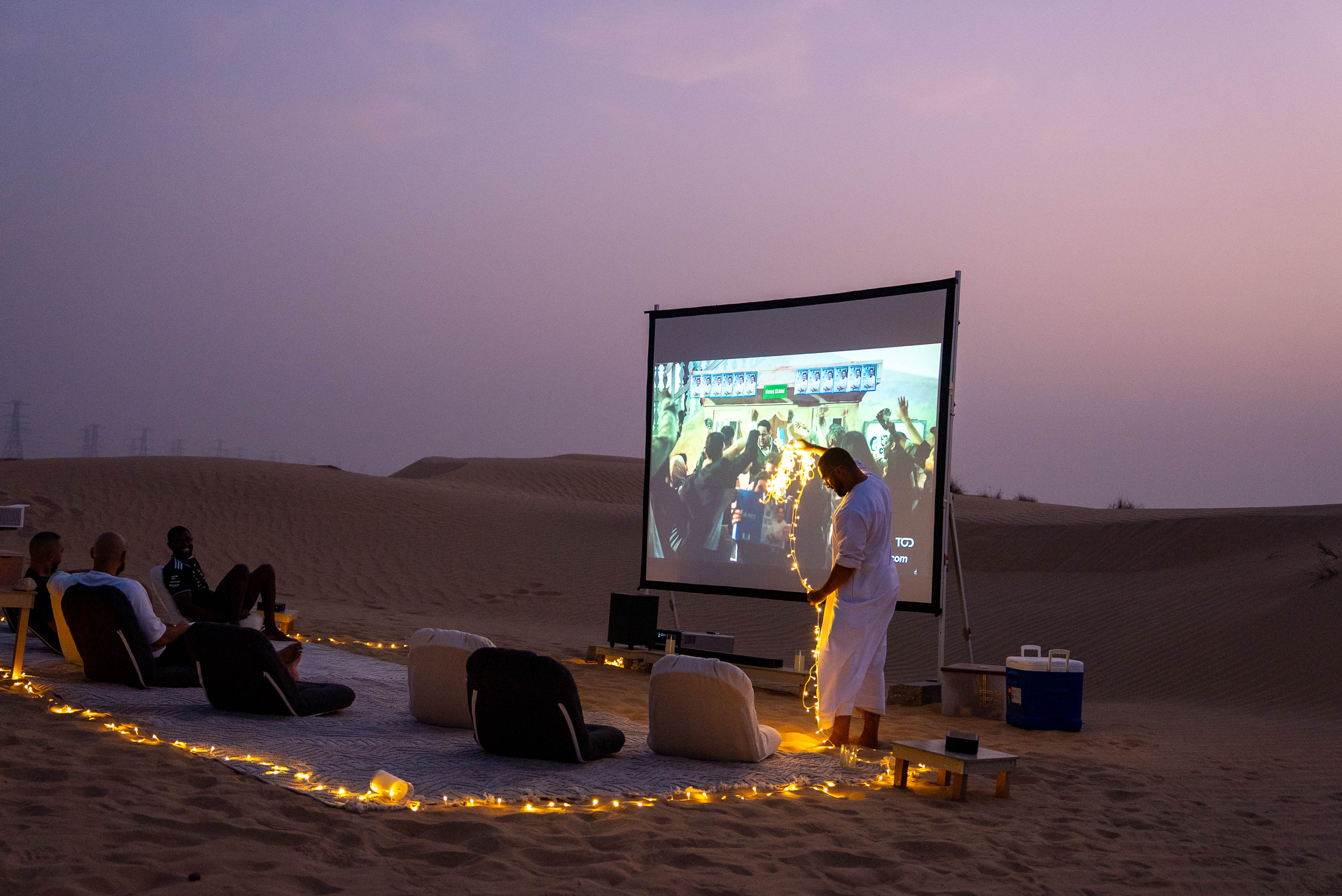 Desert cinema set-up with lanterns